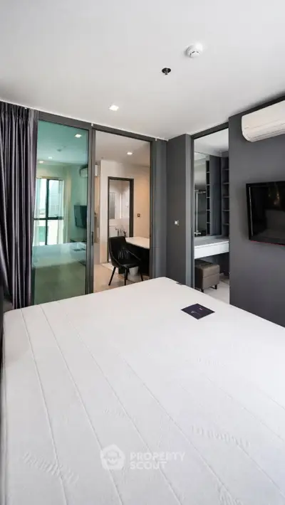 Modern bedroom with ensuite bathroom and sleek interior design