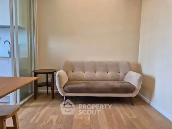 Cozy living room with modern sofa and wooden flooring