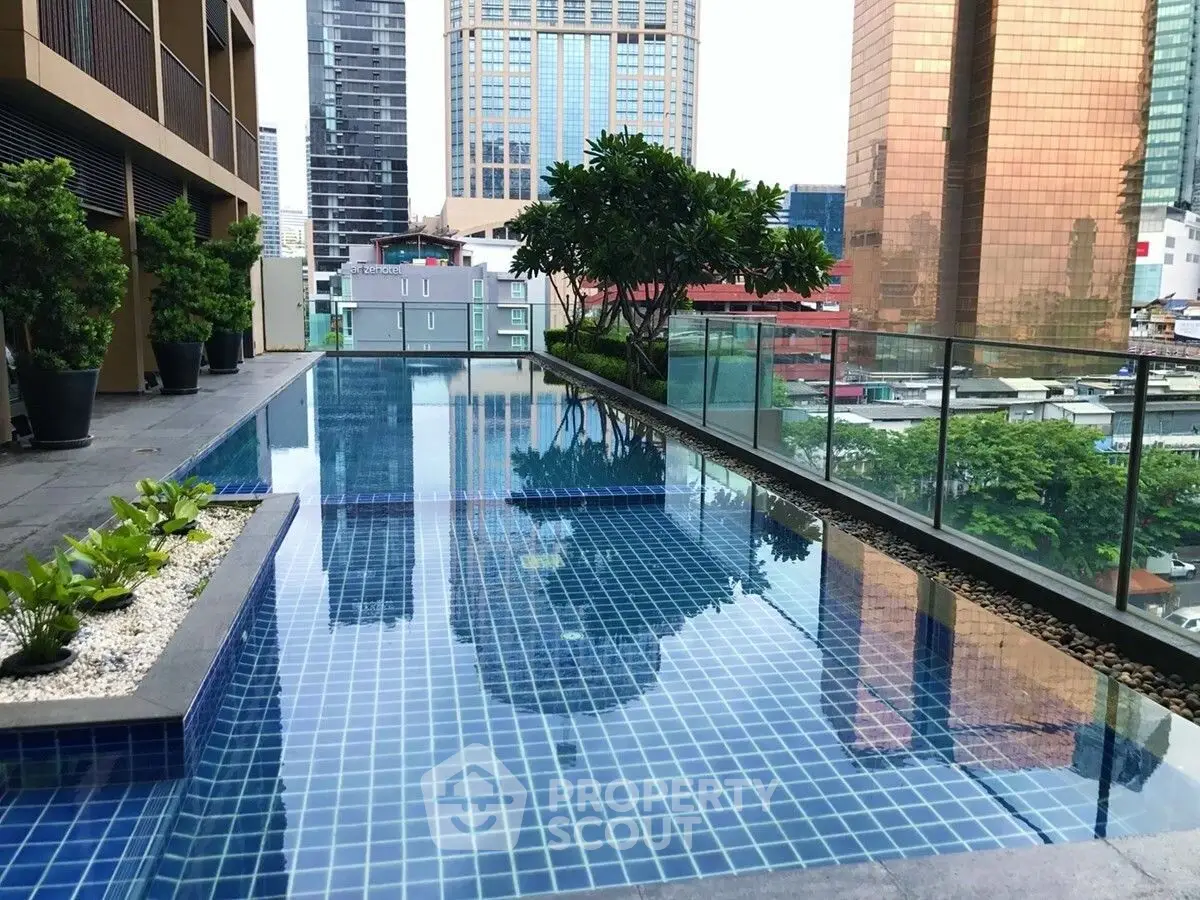 Luxurious rooftop pool with stunning cityscape views in modern urban setting.