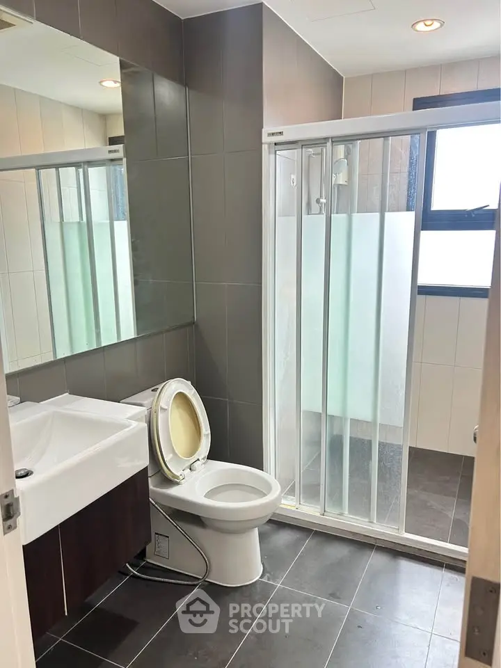 Modern bathroom with sleek design and glass shower enclosure