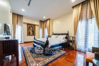 Luxurious bedroom with elegant decor and hardwood flooring