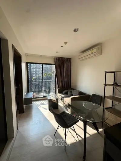 Modern living room with balcony view and stylish furniture in urban apartment