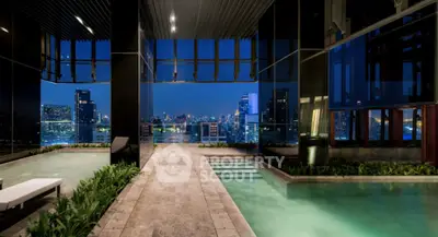Luxurious rooftop pool with stunning city skyline view at night