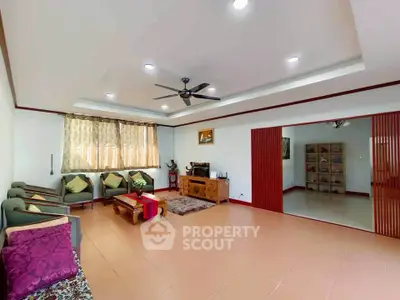 Spacious living room with elegant decor and ample natural light