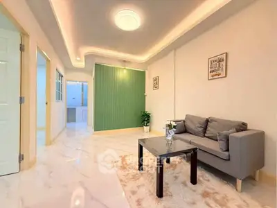 Modern living room with elegant lighting and cozy sofa in a stylish apartment.