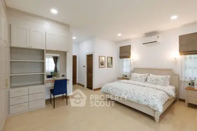 Spacious bedroom with elegant decor and ample storage space