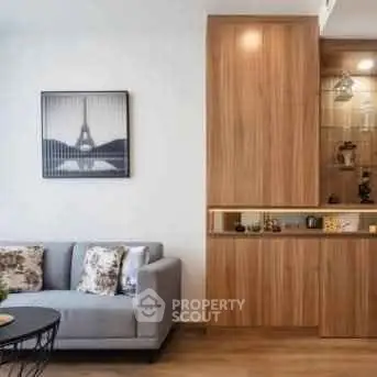 Modern living room with stylish wooden cabinetry and elegant decor