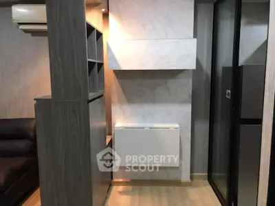 Modern interior with sleek design and efficient use of space, featuring air conditioning and stylish cabinetry.