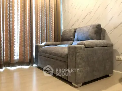 Cozy living room with stylish gray sofa and elegant curtains