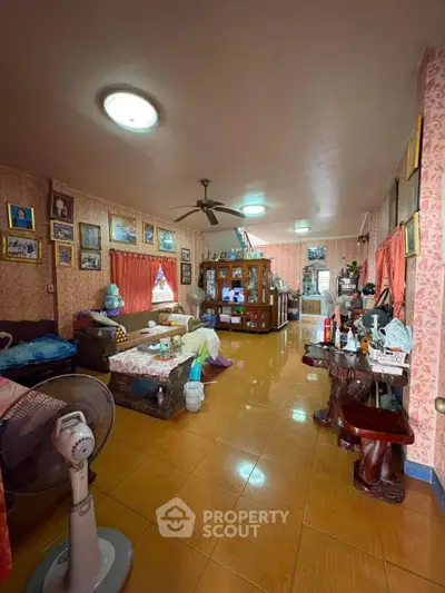 Spacious living room with vintage decor and ample natural light
