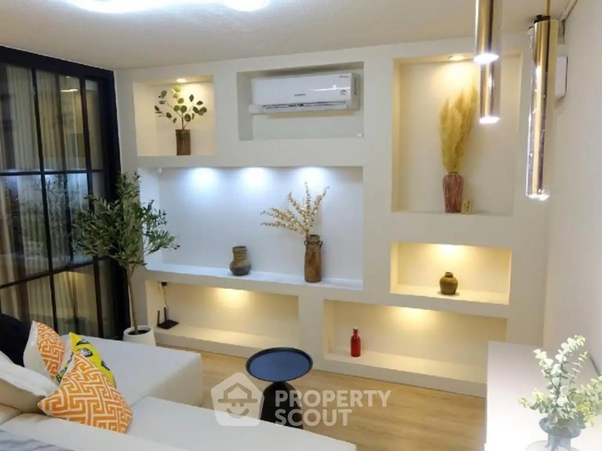 Stylish modern living room with built-in shelves and elegant decor