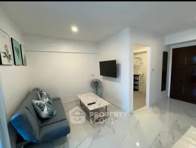 Modern living room with sleek marble flooring and stylish decor
