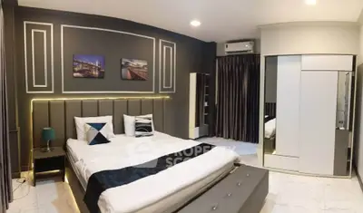 Luxurious modern bedroom with stylish decor and ambient lighting