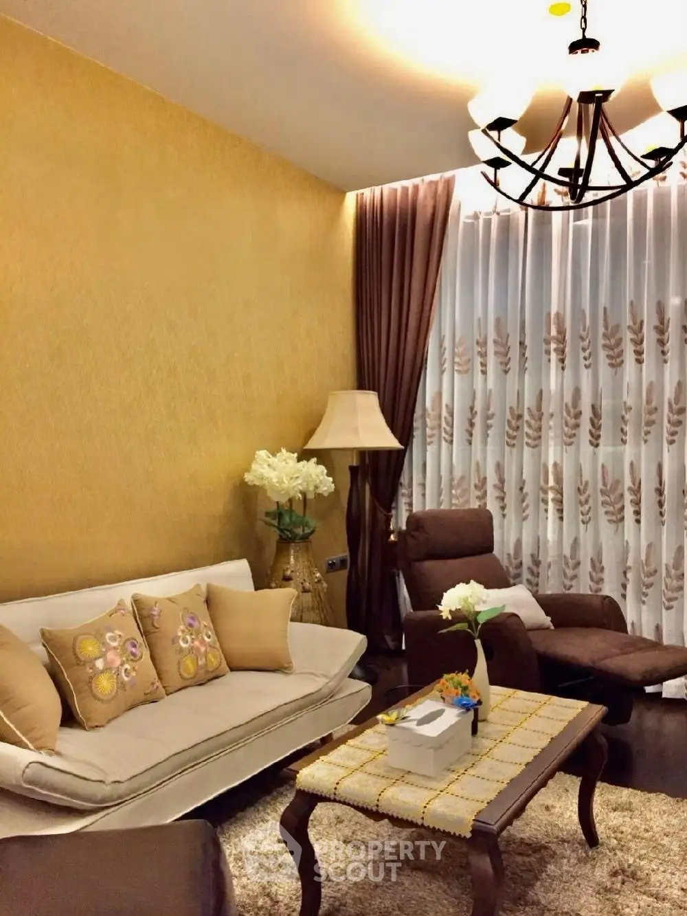 Elegant living room with cozy seating and warm lighting