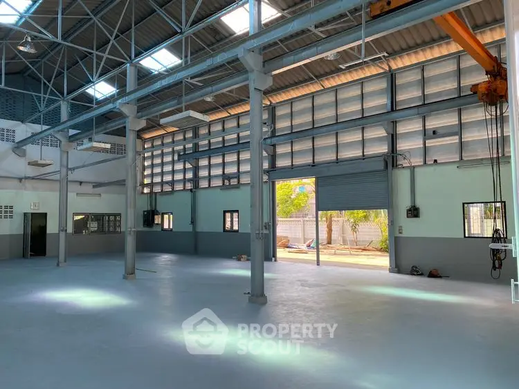 Spacious industrial warehouse with high ceilings and ample natural light
