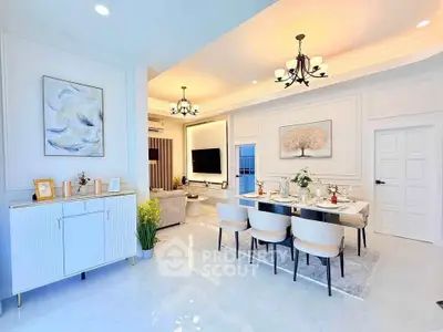Elegant open-plan living and dining area with modern decor and ambient lighting