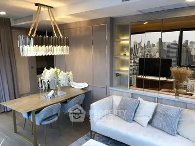 Luxurious modern living room with city view, elegant chandelier, and stylish decor.