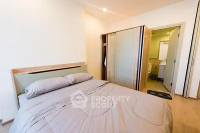 Modern bedroom with ensuite bathroom and stylish wardrobe