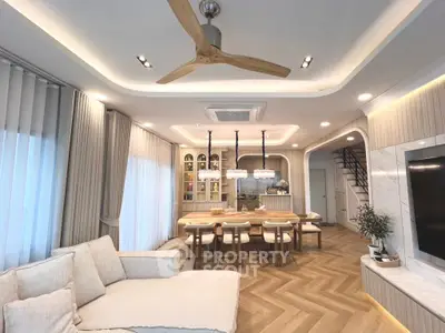 Luxurious open living room with modern decor and elegant lighting