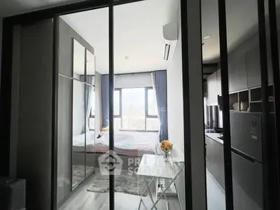 Modern studio apartment with glass partitions and city view