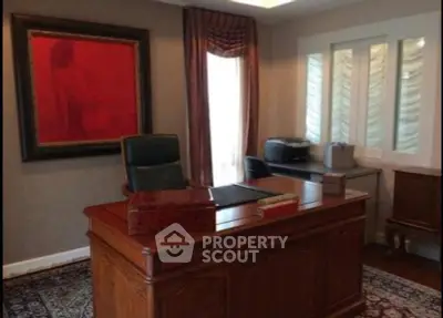 Elegant home office with wooden desk and luxurious decor