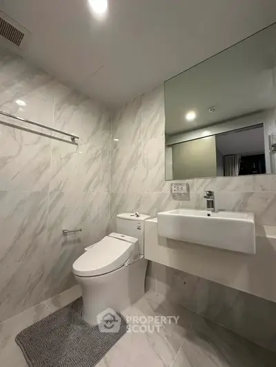 Modern bathroom with sleek fixtures and elegant marble tiles