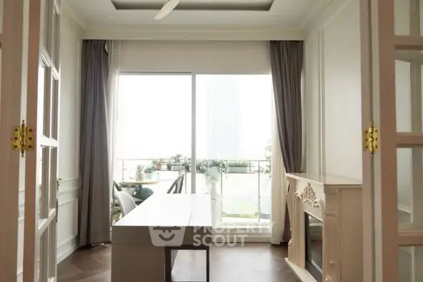 Elegant study room with large windows and classic fireplace, opening to a bright balcony.