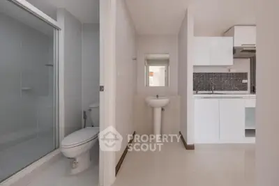 Modern minimalist bathroom and kitchen in a compact apartment