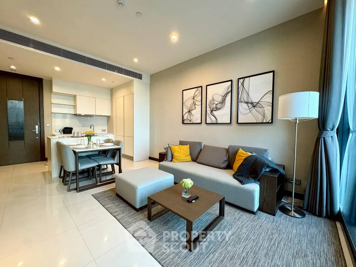 Modern open-layout living room with stylish decor and natural light
