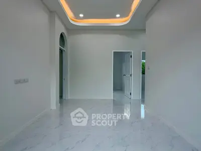 Spacious modern interior with elegant ceiling lighting and glossy marble flooring