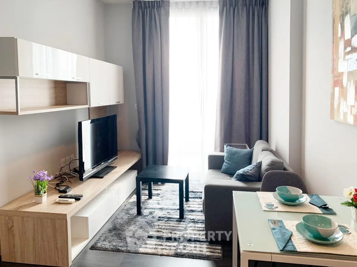 Modern living room with stylish furniture and natural light, perfect for cozy living.