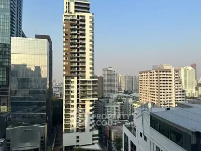 Stunning cityscape view showcasing modern high-rise buildings under a clear blue sky.