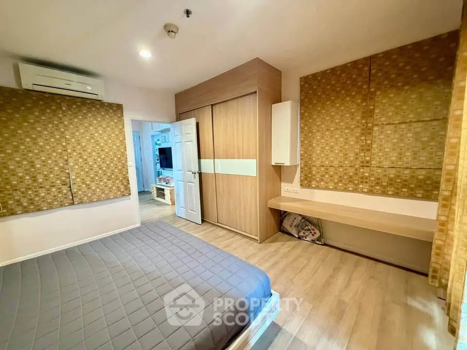 Modern bedroom with stylish decor and ample storage space