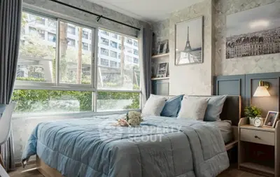 Charming bedroom with large window and elegant decor in modern apartment