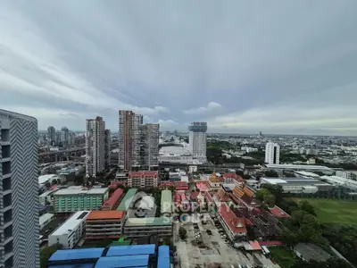 Stunning cityscape view from high-rise building showcasing urban skyline and vibrant architecture.