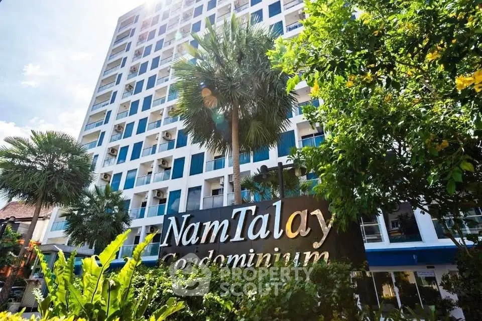 Stunning Nam Talay Condominium exterior with lush greenery and modern architecture.