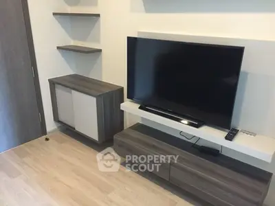 Modern living room with sleek TV unit and stylish shelving