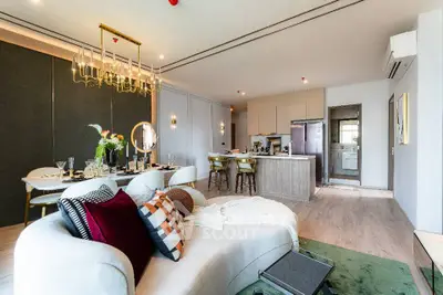 Luxurious open-plan living room with modern kitchen and elegant decor