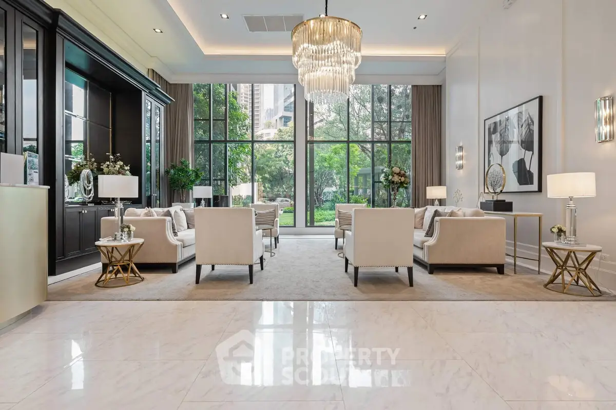 Luxurious living room with elegant chandelier and garden view, perfect for sophisticated gatherings.