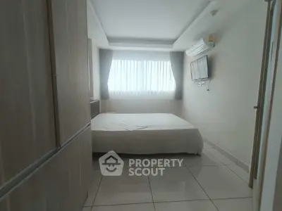 Modern bedroom with natural light and sleek design