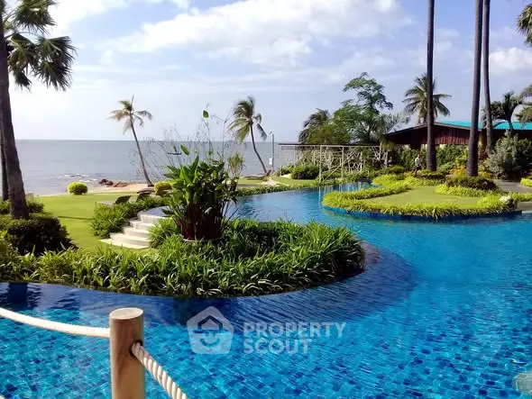 Luxurious beachfront property with stunning pool and lush gardens