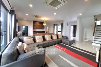 Spacious modern living room with large sectional sofa and stylish decor