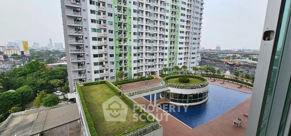Modern high-rise apartment with pool and garden view in urban setting