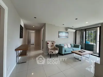 Spacious modern living room with elegant furniture and natural light