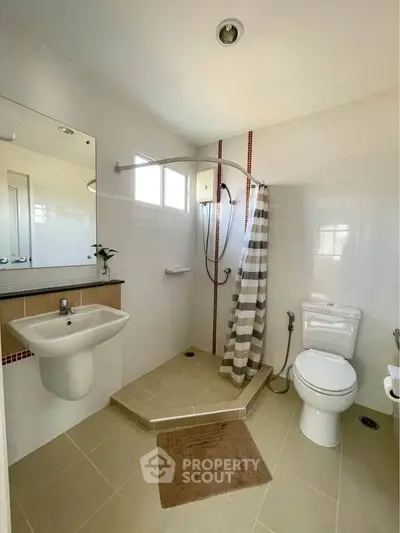 Modern bathroom with walk-in shower and sleek fixtures