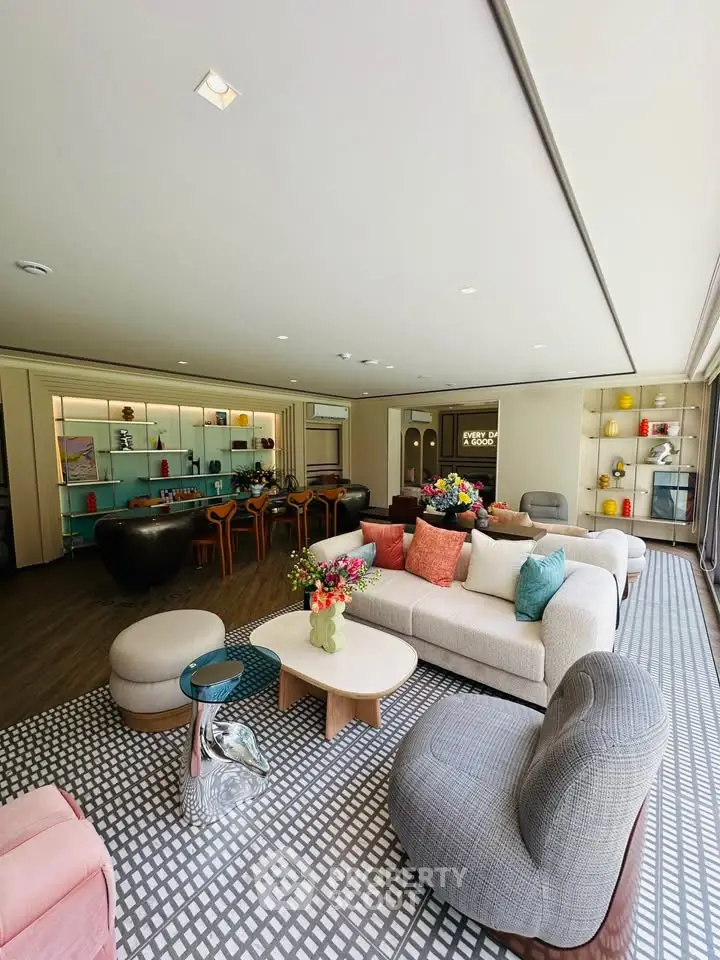 Spacious modern living room with stylish furniture and vibrant decor, perfect for entertaining.