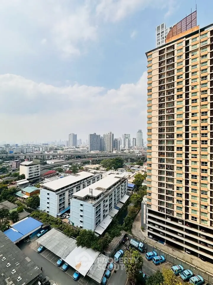 Stunning cityscape view from high-rise building with clear skies and urban skyline.