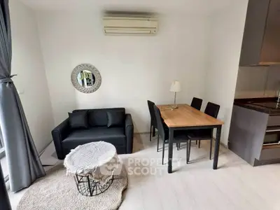 Cozy living room with modern furniture and air conditioning in a stylish apartment.