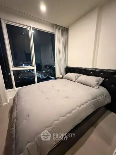 Luxurious bedroom with stunning night city view and modern decor
