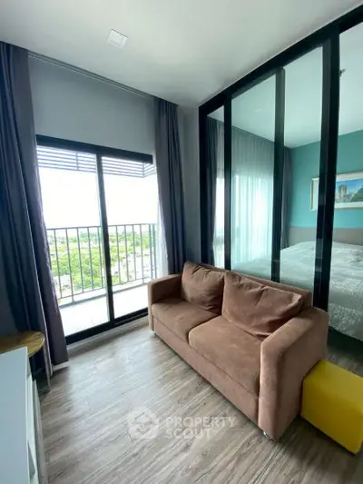 Modern living room with glass partition and balcony view in stylish apartment